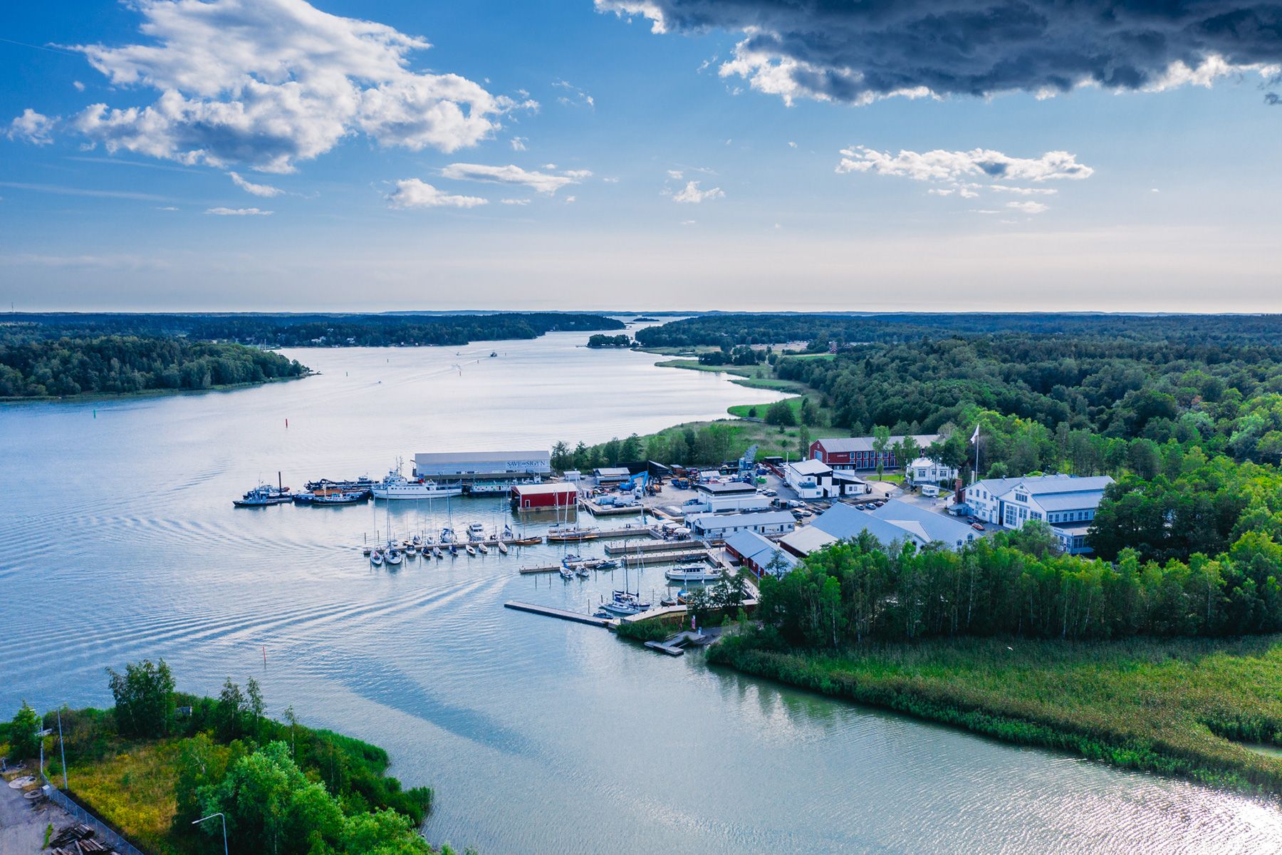 An aerial shot of Ruissalo Boatyard, where boats have been anchored a summer's day.